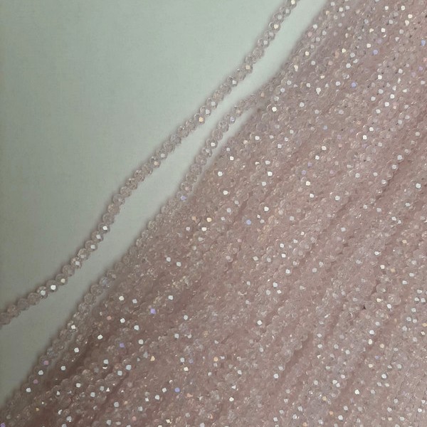 Beads Czech Crystal pink transparent faceted rondelle with 'oil slick' tint, diameter 3.5×3 mm ±, length 39 mm ± on a strand