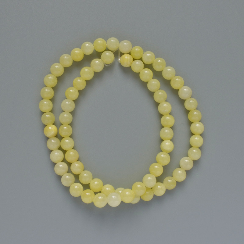 Citrine Beads (artificial acrylic) smooth sphere, diameter 6.5 mm +-, length 40 cm +- on fishing line