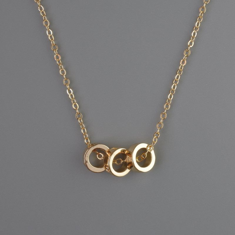 Pendant on a chain with gold-colored metal, diameter 8×3 mm, thickness 1 mm + -, length 40-45 cm +