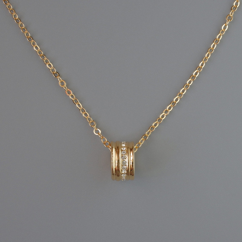 Pendant on a chain, golden metal, diameter 10x6 mm, thickness 1 mm + -, length 40-45 cm +