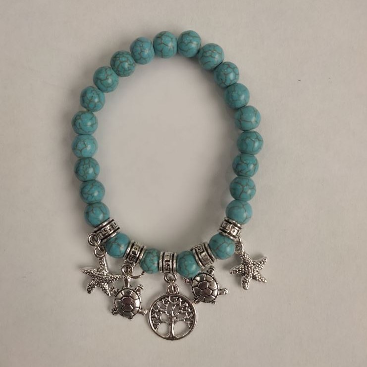 Turquoise bracelet (artificial) smooth bead, diameter 8mm ± with silvery inserts, length 18cm ± (stretch)