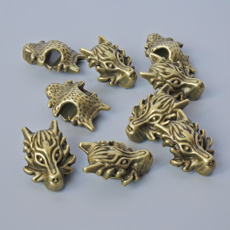 Bead Jump Ring Inlay "Dragon", diameter 18x13x8 mm, hole diameter 3.7 mm, packaging 9 pcs ±, bronze color metal