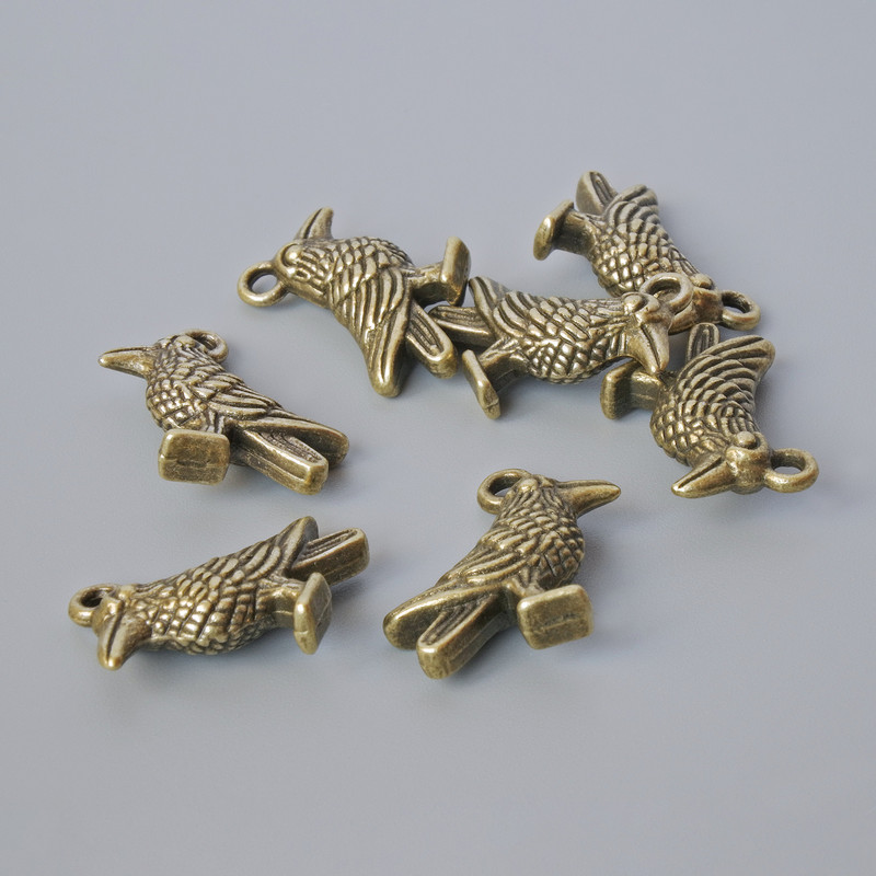 Pendant finding "Bird", diameter 18x13mm, hole diameter 1.9mm, packaged 7 pcs ±, bronze metal color