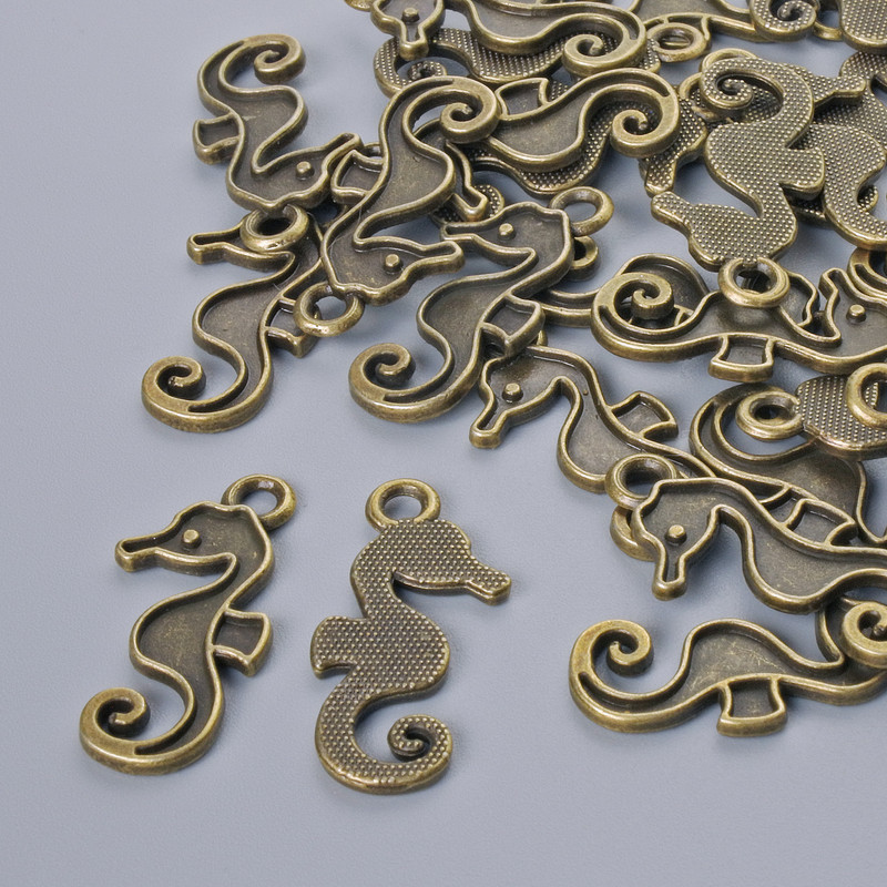 Pendant Finding "Sea Horse", diameter 22x10mm, hole diameter 2.1mm, packaged 26 pcs±, bronze metal color