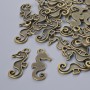 Pendant Finding "Sea Horse", diameter 22x10mm, hole diameter 2.1mm, packaged 26 pcs±, bronze metal color