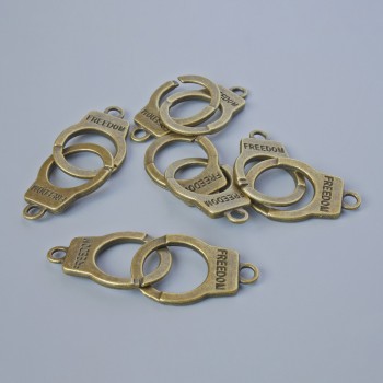 Pendant Finding "Handcuffs", diameter 23x14, 5mm, bore diameter 2.4mm, length 40mm pack 5pcs ± bronze metal color