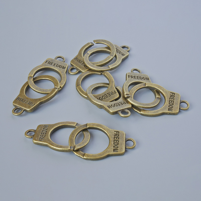 Pendant Finding "Handcuffs", diameter 23x14, 5mm, bore diameter 2.4mm, length 40mm pack 5pcs ± bronze metal color