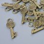 Pendant Hardware "Key", diameter 26x8mm, bore diameter 3.5mm, packaged 16 pcs±, bronze metal color