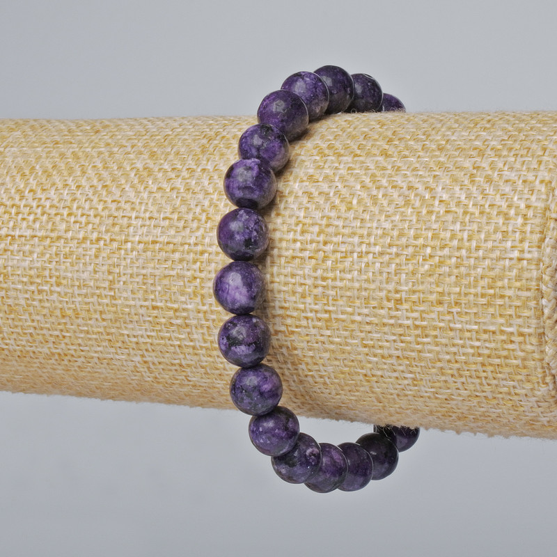 Sugilite Bracelet (faceted) smooth beads, diameter 8.5 mm ±, length 18 cm ± (stretch)