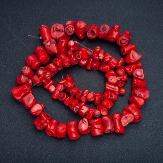 Natural Coral Beads, faceted assorted sizes, diameters from 12x10 to 30x12 mm +/-, thread length 38 cm +/- (price per 100 g)