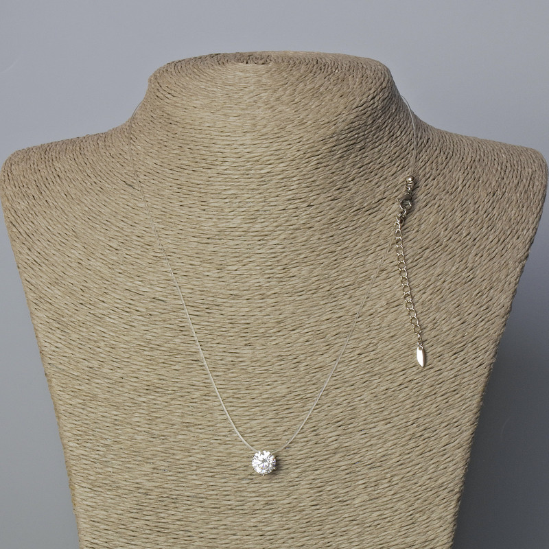 Pendant with White Crystal, 8.5 mm diameter ± on transparent thread with clasp, Xuping Rhodium plating, thickness 0.8 mm, length 45–50 cm+