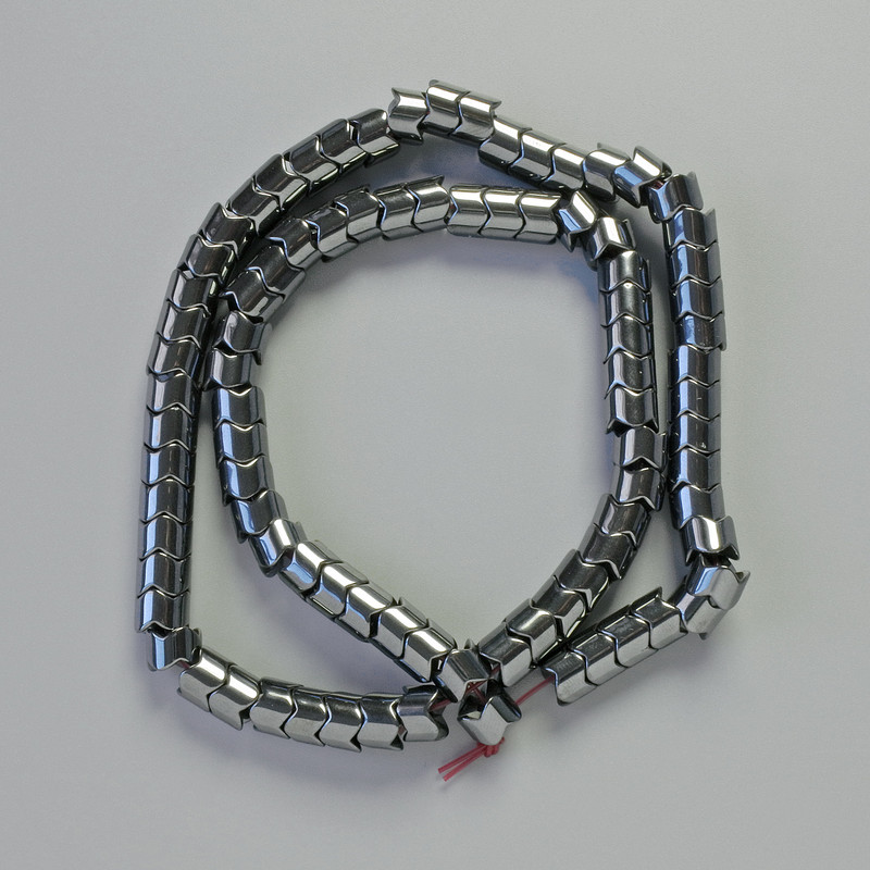 Hematite Beads cylindrical zigzag shape black, diameter 7x5mm±, length 40cm± strand