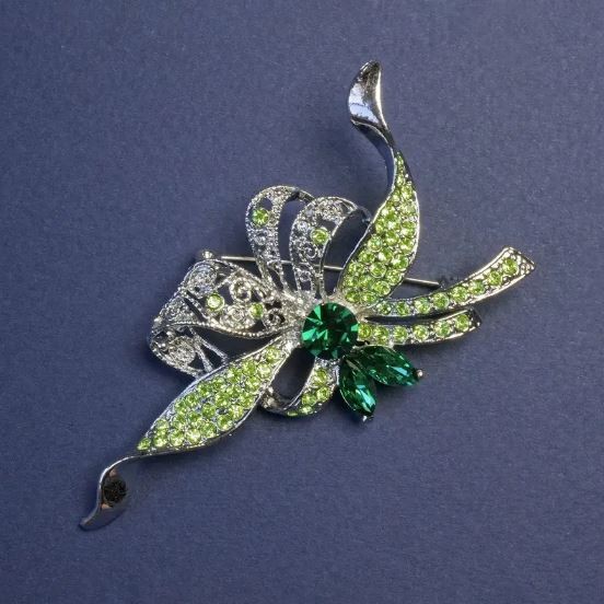 Brooch Accent with green crystals and rhinestones silver metal 78x41 mm +