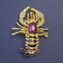 Brooch Omar purple and black enamel with golden metal 58x43mm