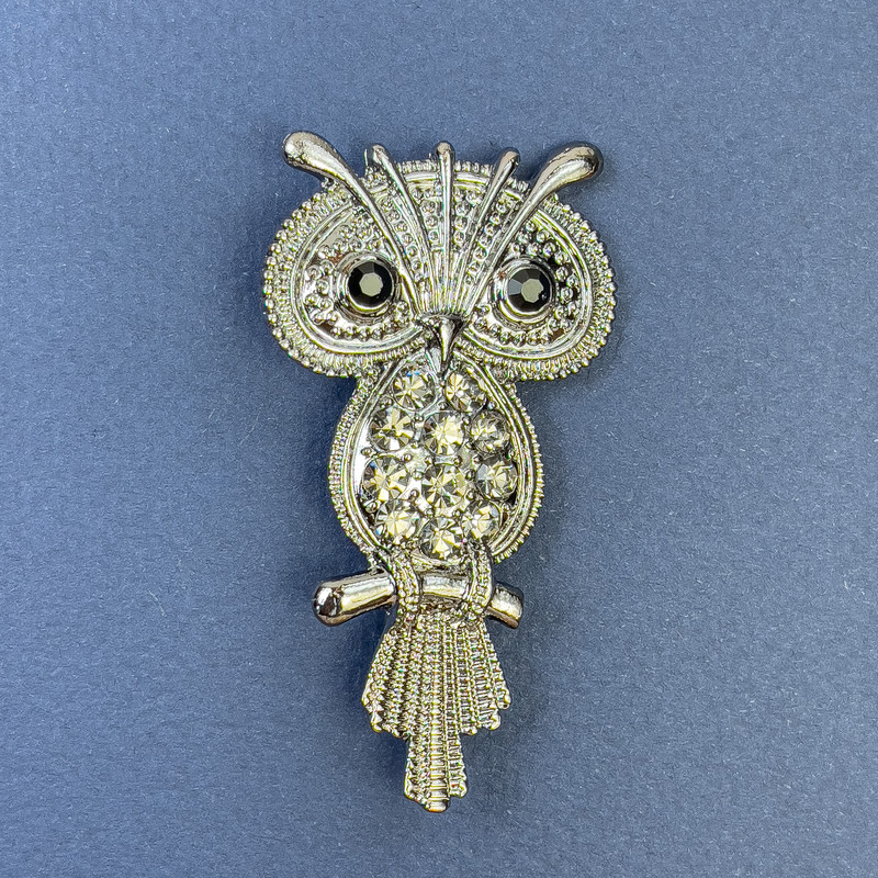 Brooch Owl with black and gray rhinestones on silver-tone metal, diameter 34mm+-, length 60mm+-