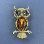 Brooch Pendant Owl Brown and Black Crystals Golden Metal, diameter 26mm+-, length 44mm+-