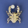 Brooch 'Scarab' with Pearl and White Rhinestones, Golden Metal 40x33mm