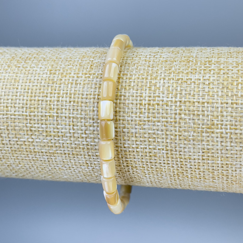 Bracelet with Mother of Pearl, faceted, diameter 6x5mm ±, length 18cm ±, stretch