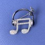 Brooch 'Note in Headphones' with white crystals on black enamel, silver metal 27x32mm+