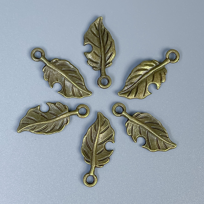Pendant Finding Leaf Bronze Tone, size 23×10×1 mm±, hole diameter 2 mm±, packaged 20 g (~26 pieces)