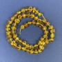 Amber Beads Cabochon-cut 6x4 mm on a Thread with 2 mm Beads ±, length 39 cm+