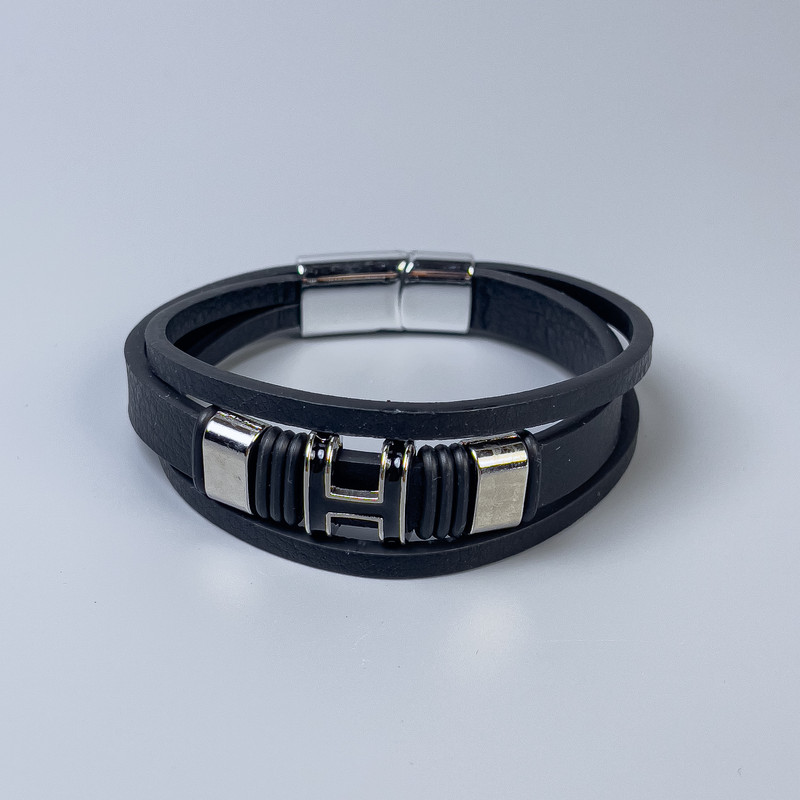 Men's bracelet with black eco-leather and metal inlays, thickness 12-25mm ±, length 22cm ±, silver metal clasp
