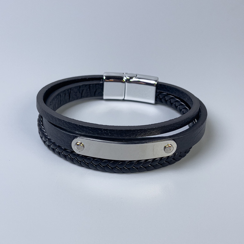 Men's bracelet made of eco-leather in black with metal insets, thickness 10-19mm+-, length 22cm+- with silver metal on the clasp