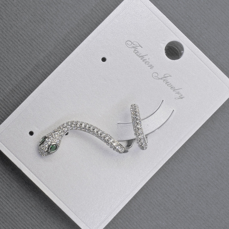 Cafeearring 'Snake' on the ear in silver metal 14x30 mm± white and green rhinestones