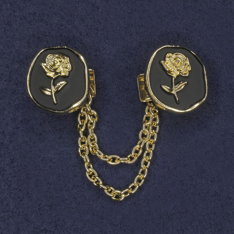 Brooch for cardigans with black enamel and golden metal, diameter 20mm±, chain length 9cm+