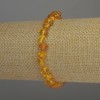Bracelet Amber tumbled, 7x5 mm beads, 2 mm seed beads, stretched 18 cm