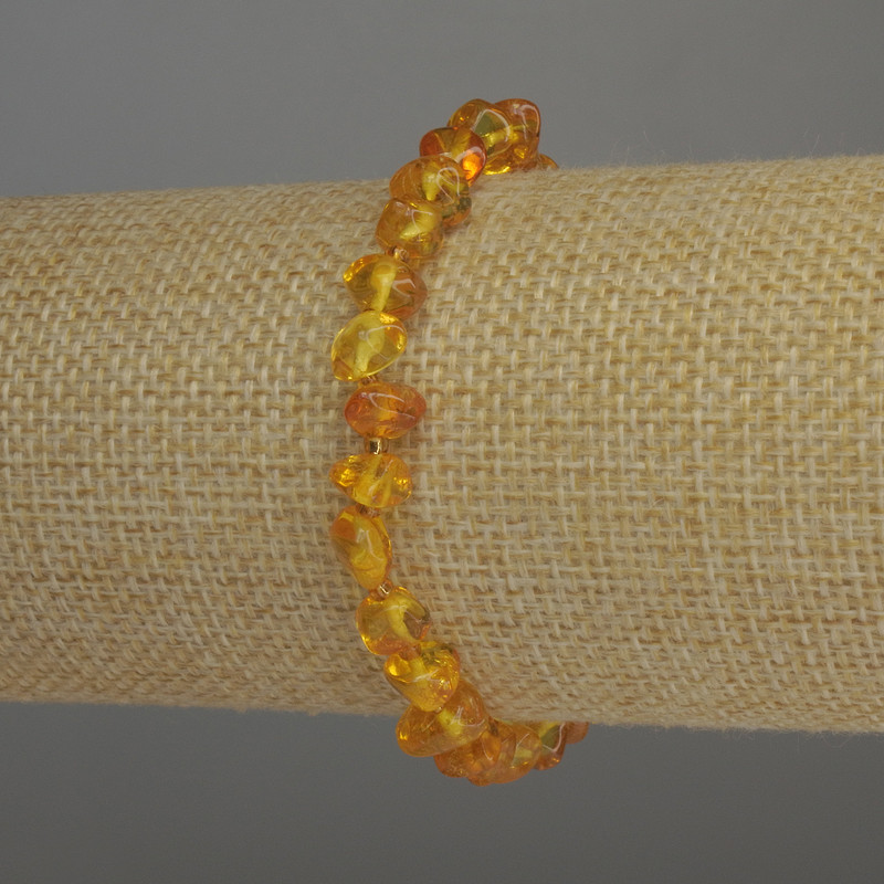 Bracelet Amber tumbled, 7x5 mm beads, 2 mm seed beads, stretched 18 cm
