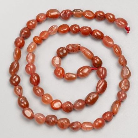 Carnelian Beads faceted on thread, diameter 8-10 mm, length 40 cm