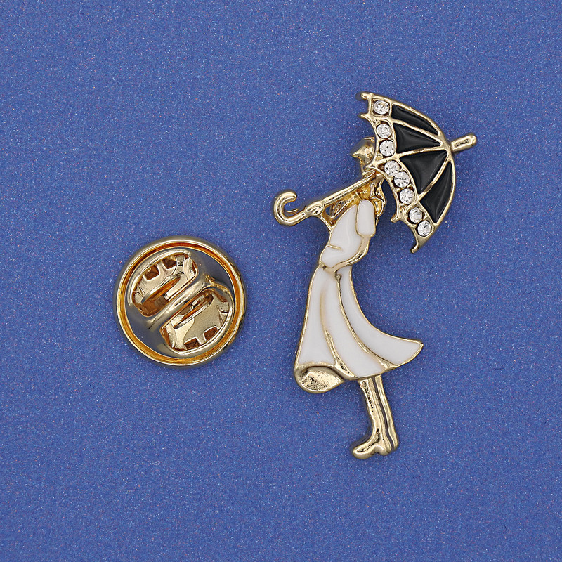 Brooch 'Girl with Umbrella' with white crystals, white enamel, golden metal 32×16mm+