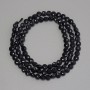 Black tourmaline beads, faceted coin-shaped, 4mm diameter ±, 39cm long on a thread