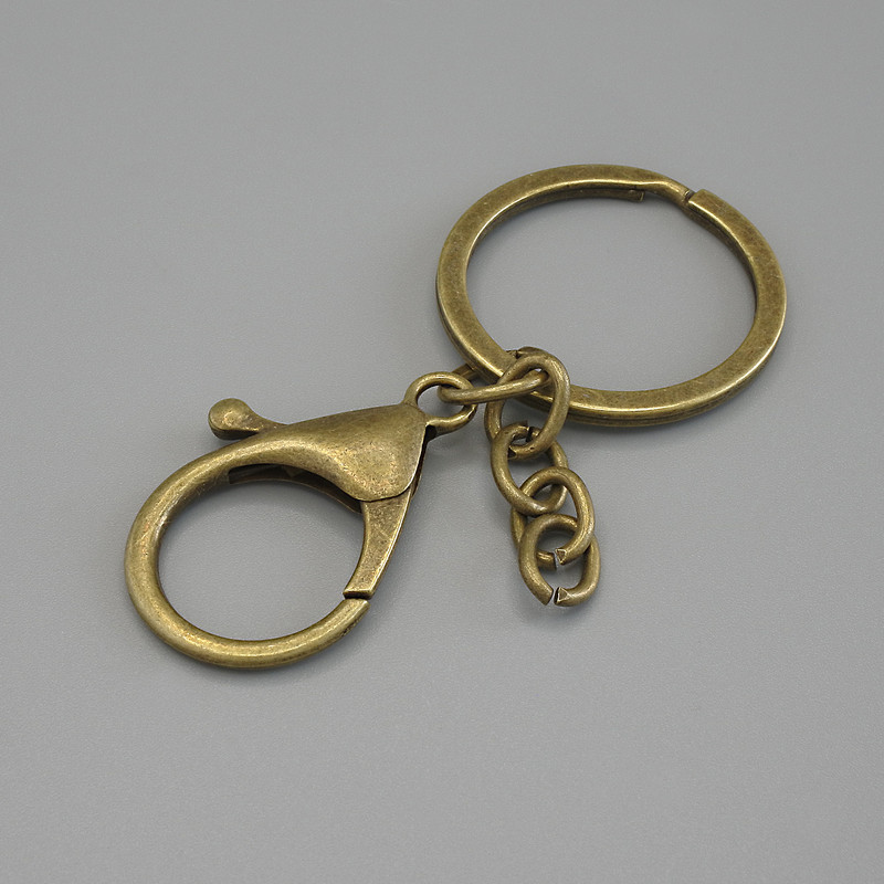 Price per pack /10 pcs. Keychain base with two clasps 33x24mm ± and ring, diameter 3 cm, length 7 cm