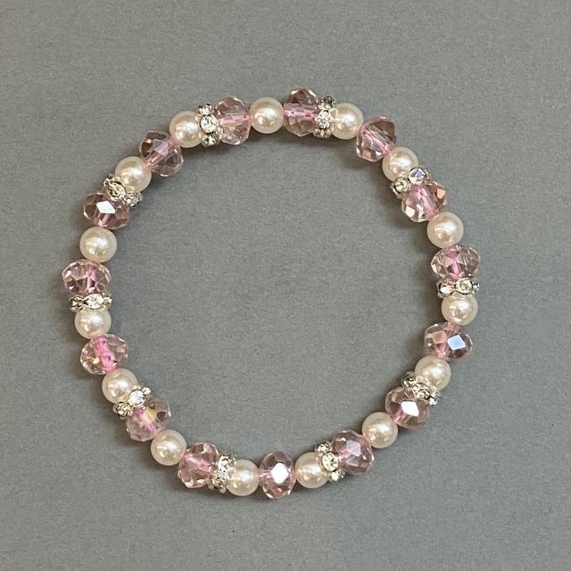 Bracelet with Czech crystal rondels, diameter 8x6mm ±, Faux pearls (beads) 6mm ±, with metal inserts, length 18mm ±, stretch