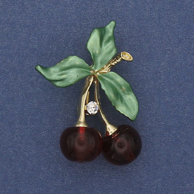 Brooch 'Cherries' green enamel with white crystals on gold-toned metal 39x28mm+