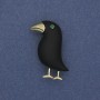 Brooch 'Bird' in black matte with green rhinestone and golden metal 36x21mm+