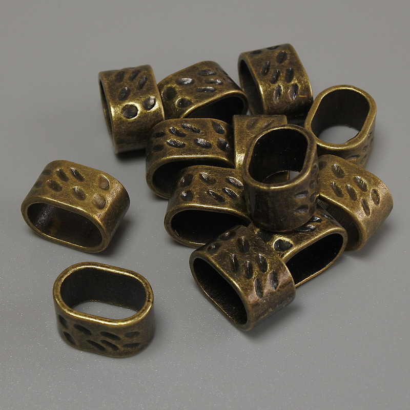 Row Spacer with Bronze Tone Insert, hole diameter 13x9mm±, insert diameter 11x7mm±, packaging 20 g (~13 pcs)