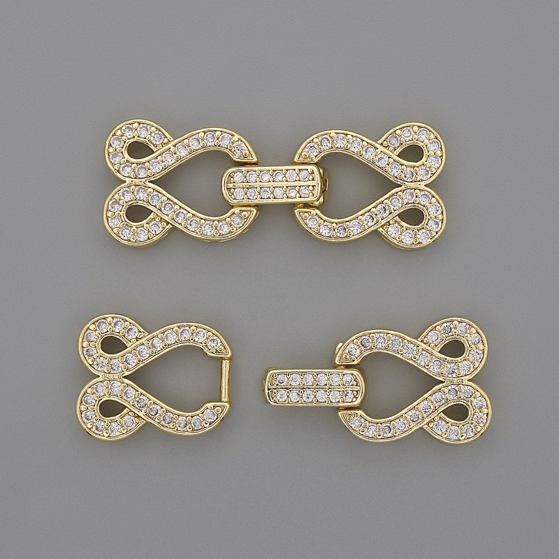 Clasp for 2-strand with white rhinestones, diameter 30×12 mm ± gold colored metal