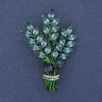 Brooch 'Branch' with blue and white rhinestones on golden metal 43x29mm +