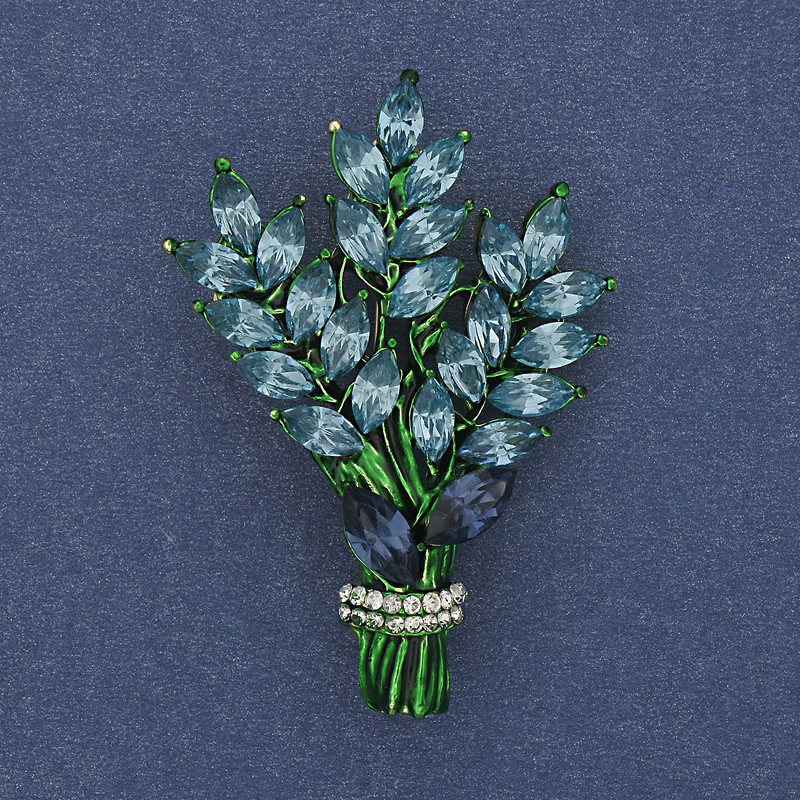 Brooch 'Branch' with blue and white rhinestones on golden metal 43x29mm +