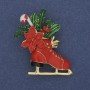 Brooch 'New Year Skater' red and green enamel on golden metal 27x38mm +