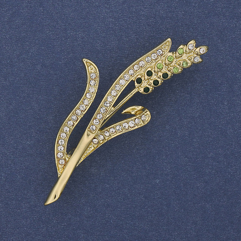 Brooch 'Ear of Grain' with green and white rhinestones on golden metal 20x53mm+