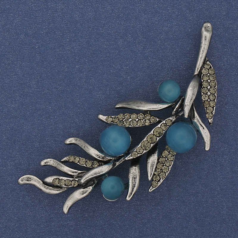 Brooch 'Twig' with blue cat's eye and gray crystals 67x26mm Silver metal
