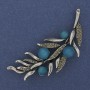 Brooch 'Twig' with blue cat's eye and gray crystals 67x26mm Silver metal