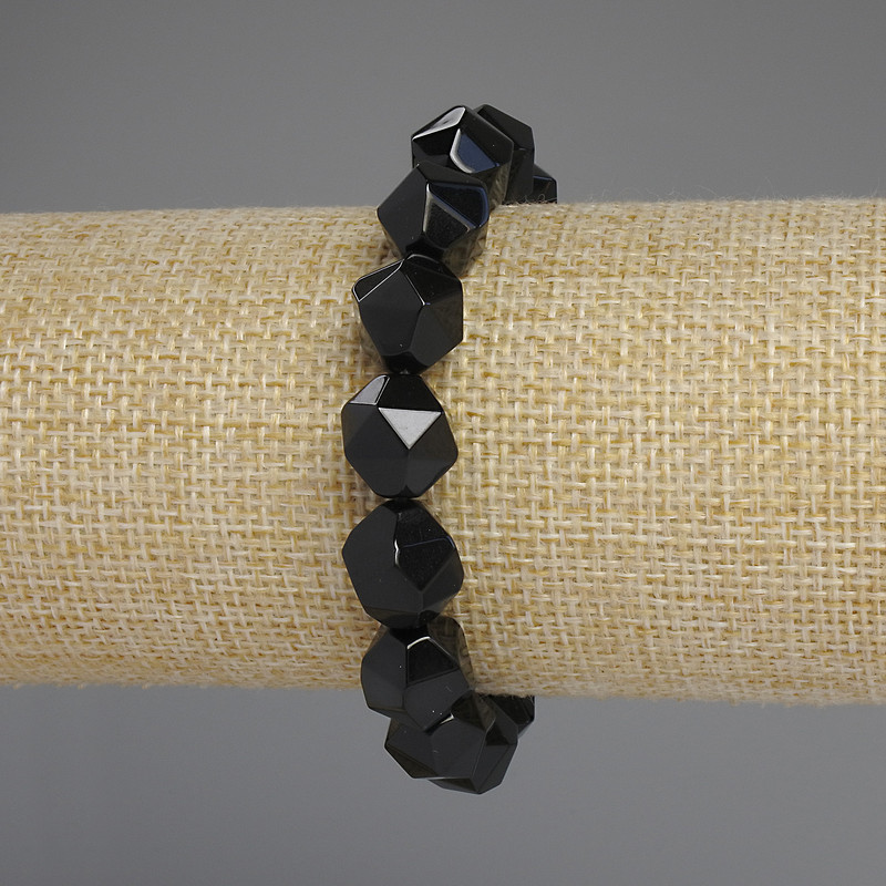 Bracelet, black Onyx, facets, diameter 12x10 mm+, length 18 cm±, stretch