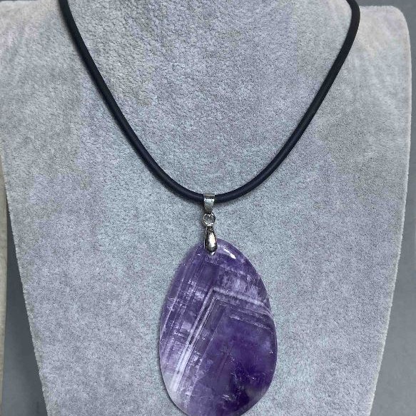 Amethyst Pendant 40x55mm (±) on a rubber cord, length 60cm + 5cm extender chain