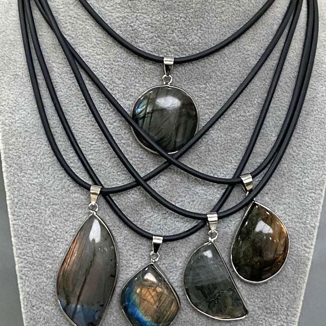 Pendant with Labradorite in a setting, assorted diameter 30x52x10-44x25x8mm+- on a cord, length 50cm+5cm+- chain