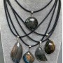 Pendant with Labradorite in a setting, assorted diameter 30x52x10-44x25x8mm+- on a cord, length 50cm+5cm+- chain